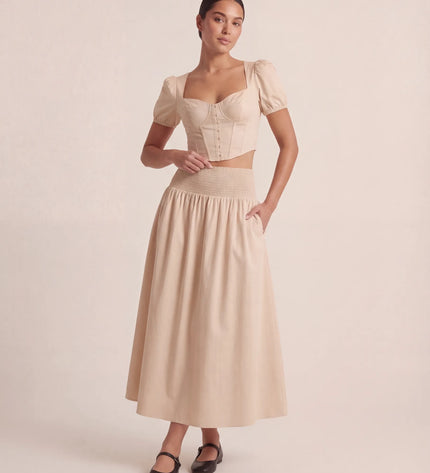 THE NOVA SHIRRED WAIST MAXI SKIRT IN BEIGE