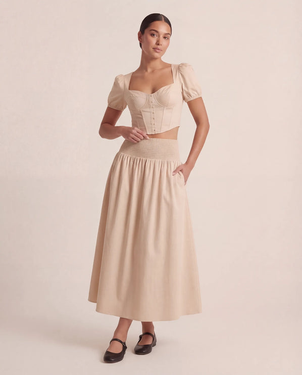 THE NOVA SHIRRED WAIST MAXI SKIRT IN BEIGE