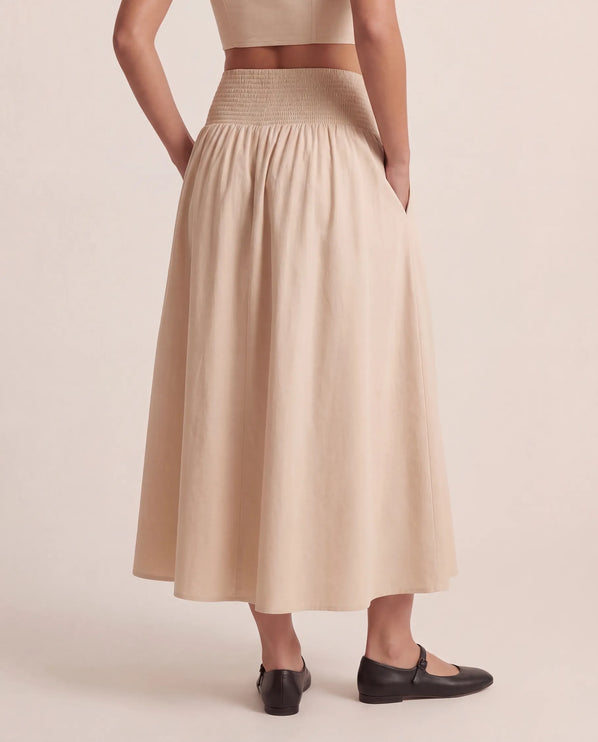 THE NOVA SHIRRED WAIST MAXI SKIRT IN BEIGE
