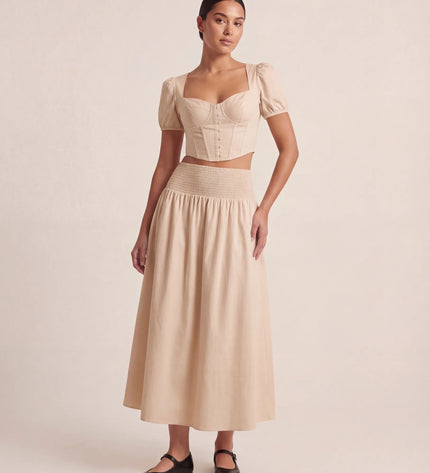 THE NOVA SHIRRED WAIST MAXI SKIRT IN BEIGE
