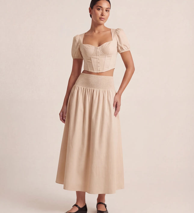THE NOVA SHIRRED WAIST MAXI SKIRT IN BEIGE