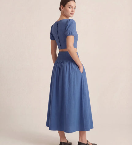THE NOVA SHIRRED WAIST MAXI SKIRT IN BLUE