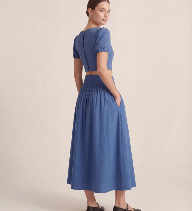 THE NOVA SHIRRED WAIST MAXI SKIRT IN BLUE