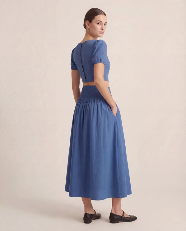 THE NOVA SHIRRED WAIST MAXI SKIRT IN BLUE