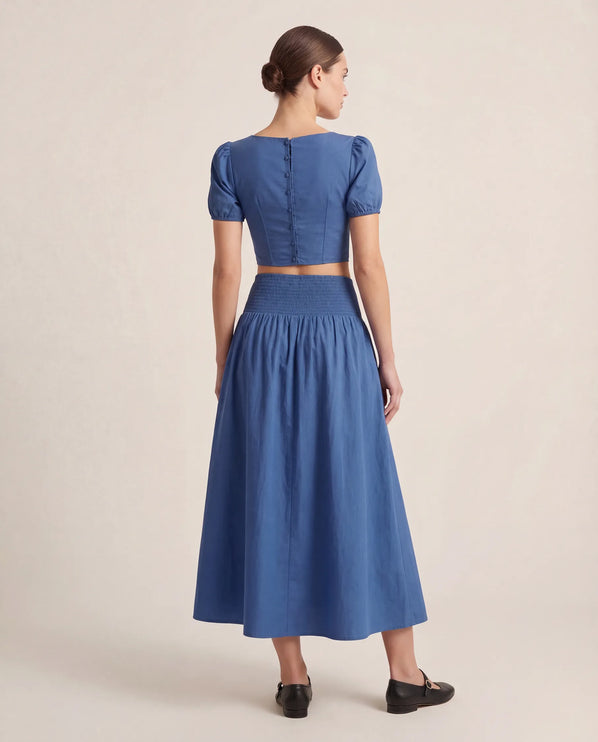 THE NOVA SHIRRED WAIST MAXI SKIRT IN BLUE