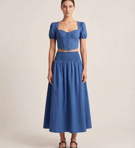 THE NOVA SHIRRED WAIST MAXI SKIRT IN BLUE
