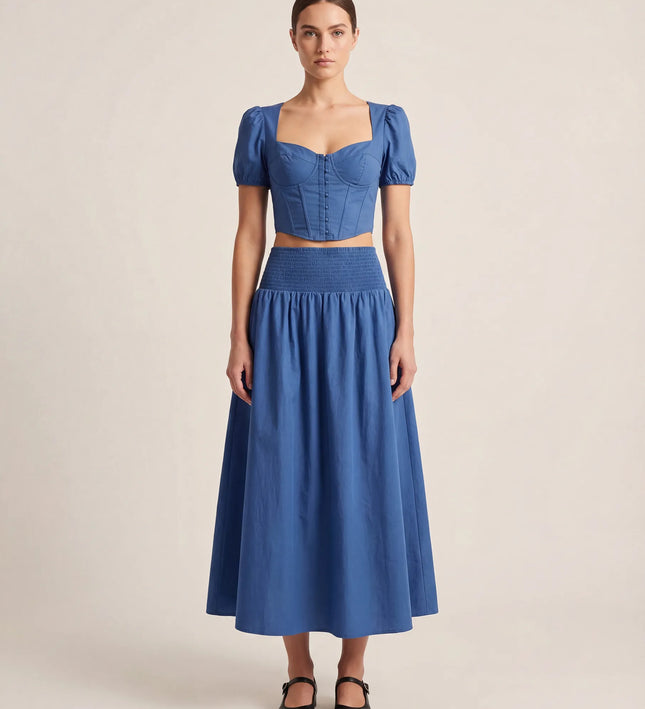 THE NOVA SHIRRED WAIST MAXI SKIRT IN BLUE