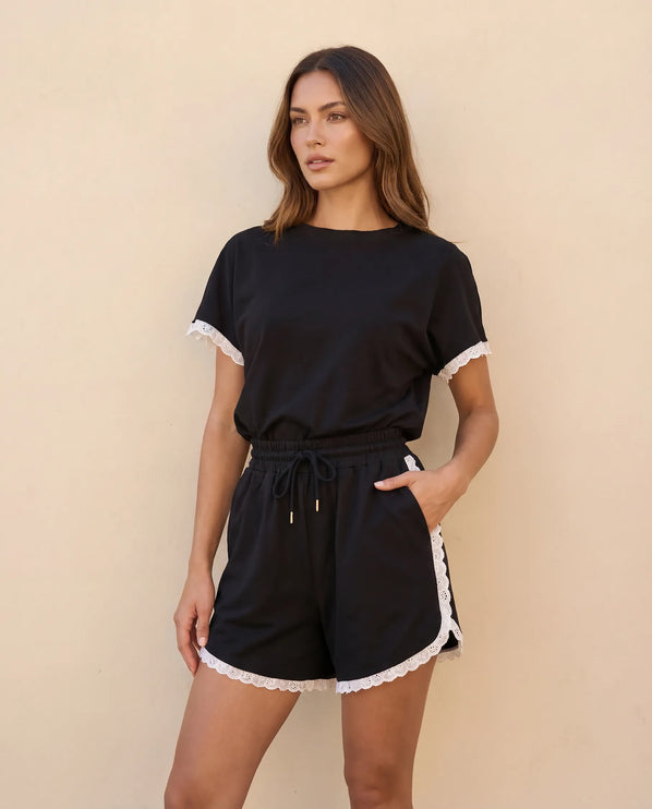THE AMIE LACE TRIM ROMPER IN BLACK