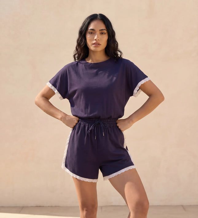 THE AMIE LACE TRIM ROMPER IN NAVY
