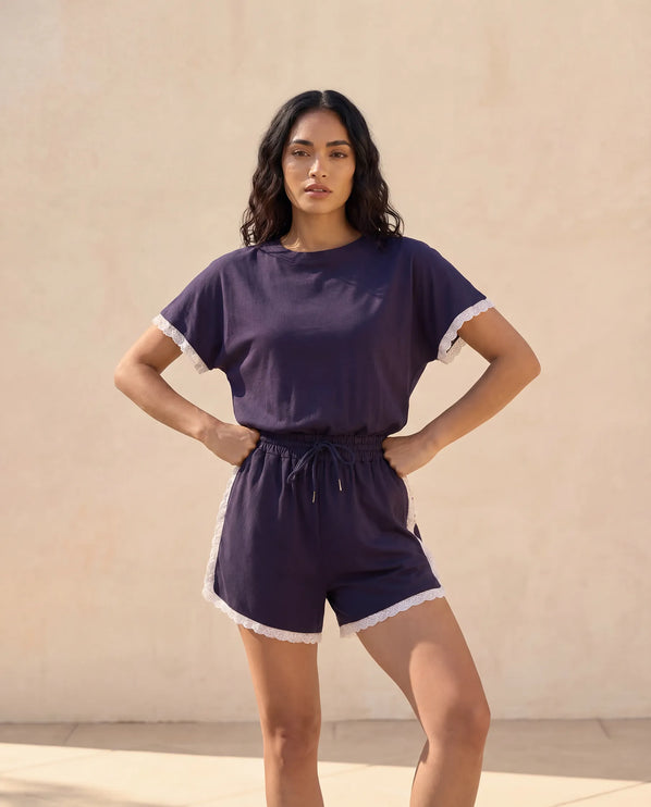 THE AMIE LACE TRIM ROMPER IN NAVY