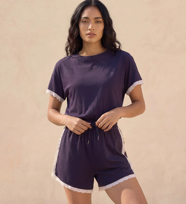 THE AMIE LACE TRIM ROMPER IN NAVY