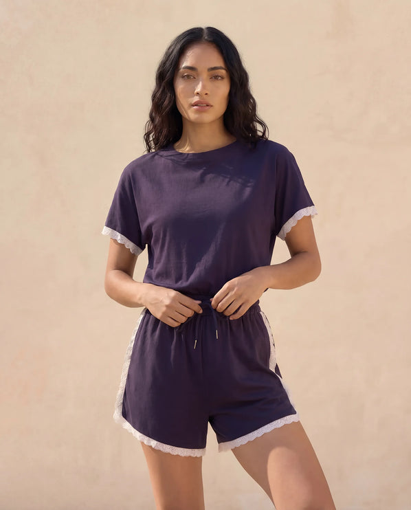 THE AMIE LACE TRIM ROMPER IN NAVY