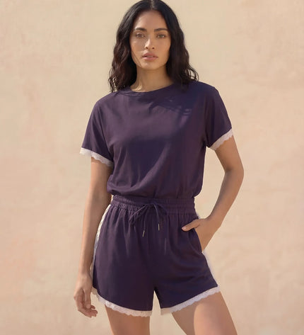 THE AMIE LACE TRIM ROMPER IN NAVY