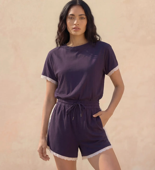THE AMIE LACE TRIM ROMPER IN NAVY