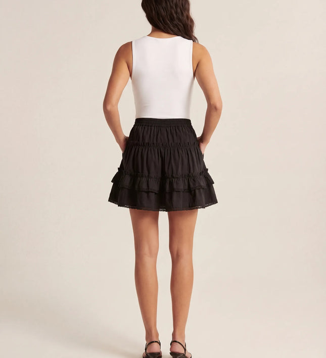 THE LYRA BRODERIE & FRILL PANEL MINI SKIRT IN BLACK