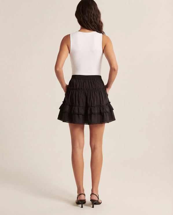 THE LYRA BRODERIE & FRILL PANEL MINI SKIRT IN BLACK
