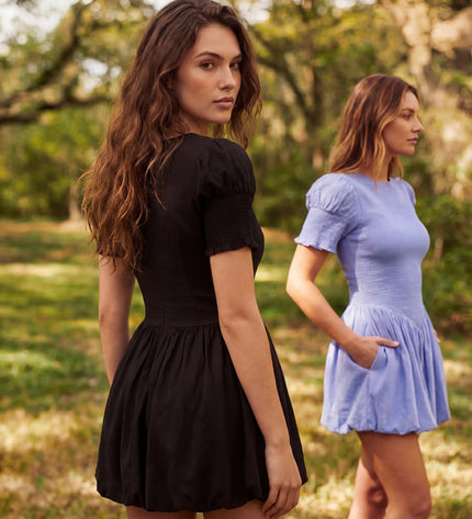 THE MIRA SMOCKED BUBBLE MINI DRESS IN BLACK