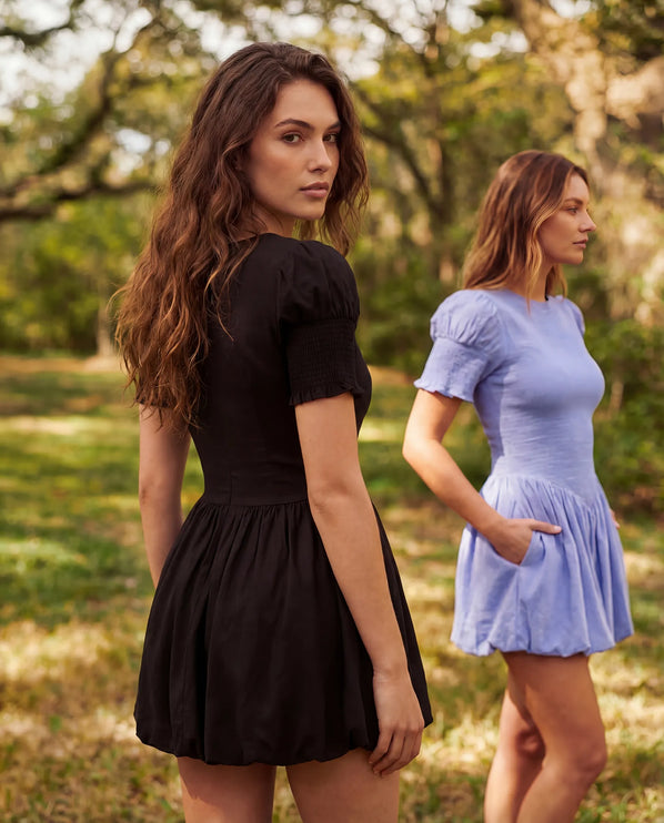 THE MIRA SMOCKED BUBBLE MINI DRESS IN BLACK
