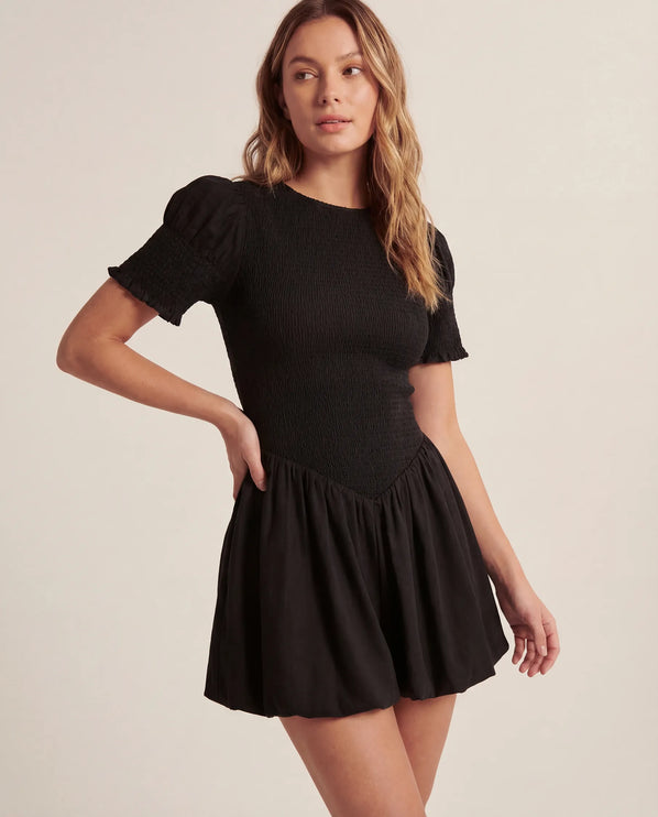 THE MIRA SMOCKED BUBBLE MINI DRESS IN BLACK