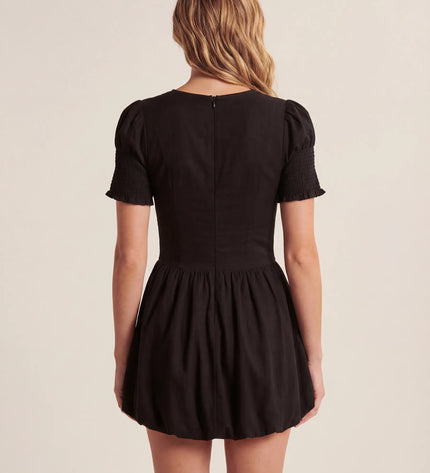 THE MIRA SMOCKED BUBBLE MINI DRESS IN BLACK