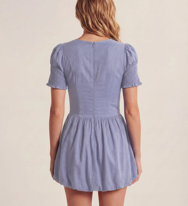 THE MIRA SMOCKED BUBBLE MINI DRESS IN BLUE