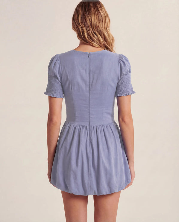 THE MIRA SMOCKED BUBBLE MINI DRESS IN BLUE