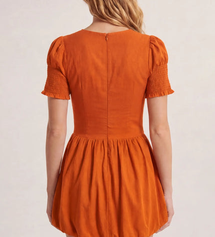 THE MIRA SMOCKED BUBBLE MINI DRESS IN ORANGE