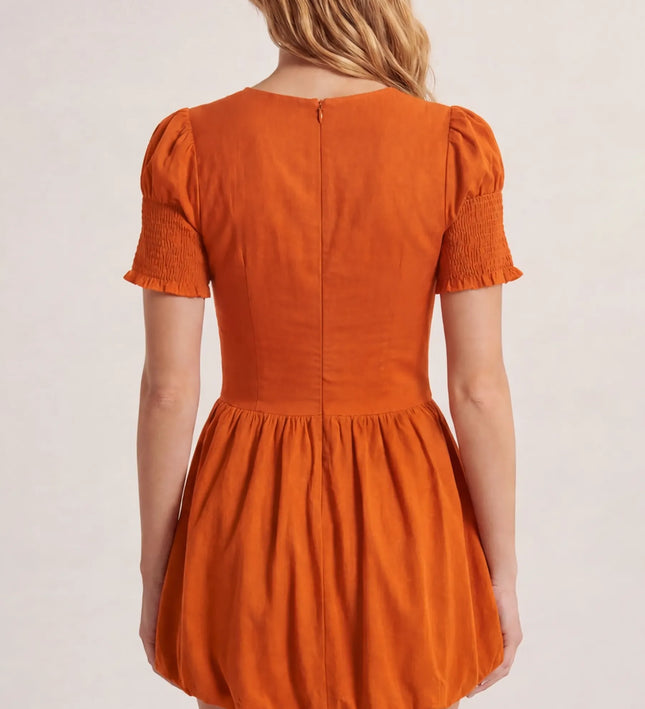 THE MIRA SMOCKED BUBBLE MINI DRESS IN ORANGE