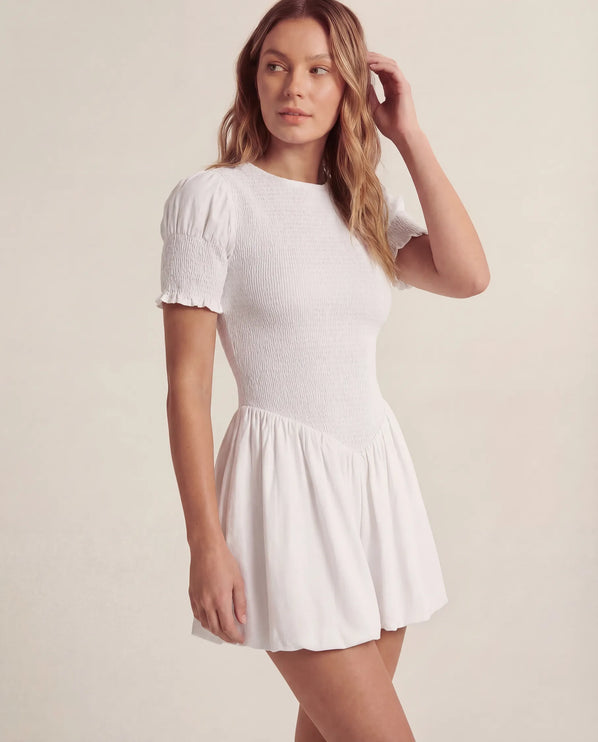 THE MIRA SMOCKED BUBBLE MINI DRESS IN WHITE